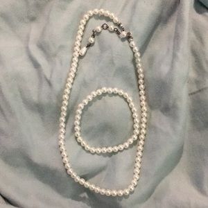Costume pearl necklace and pearl bracelet.